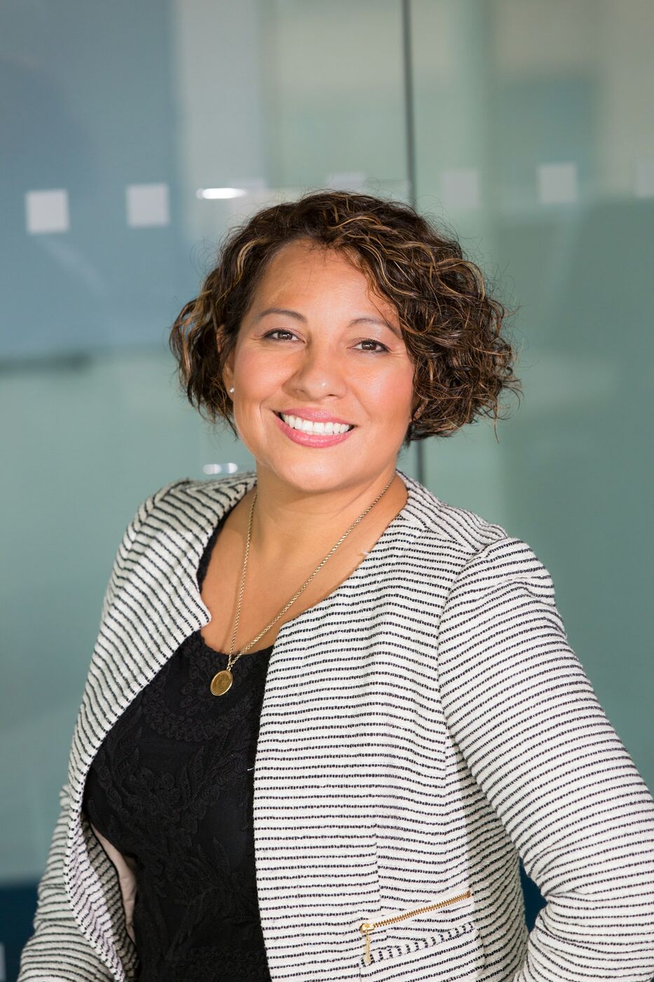 A Mazel personal assistant smiling in a professional setting